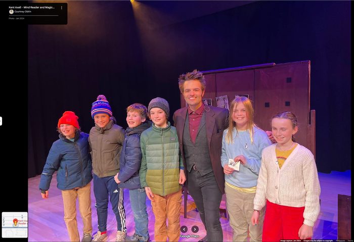 Kent Axell with three young audience members after the show